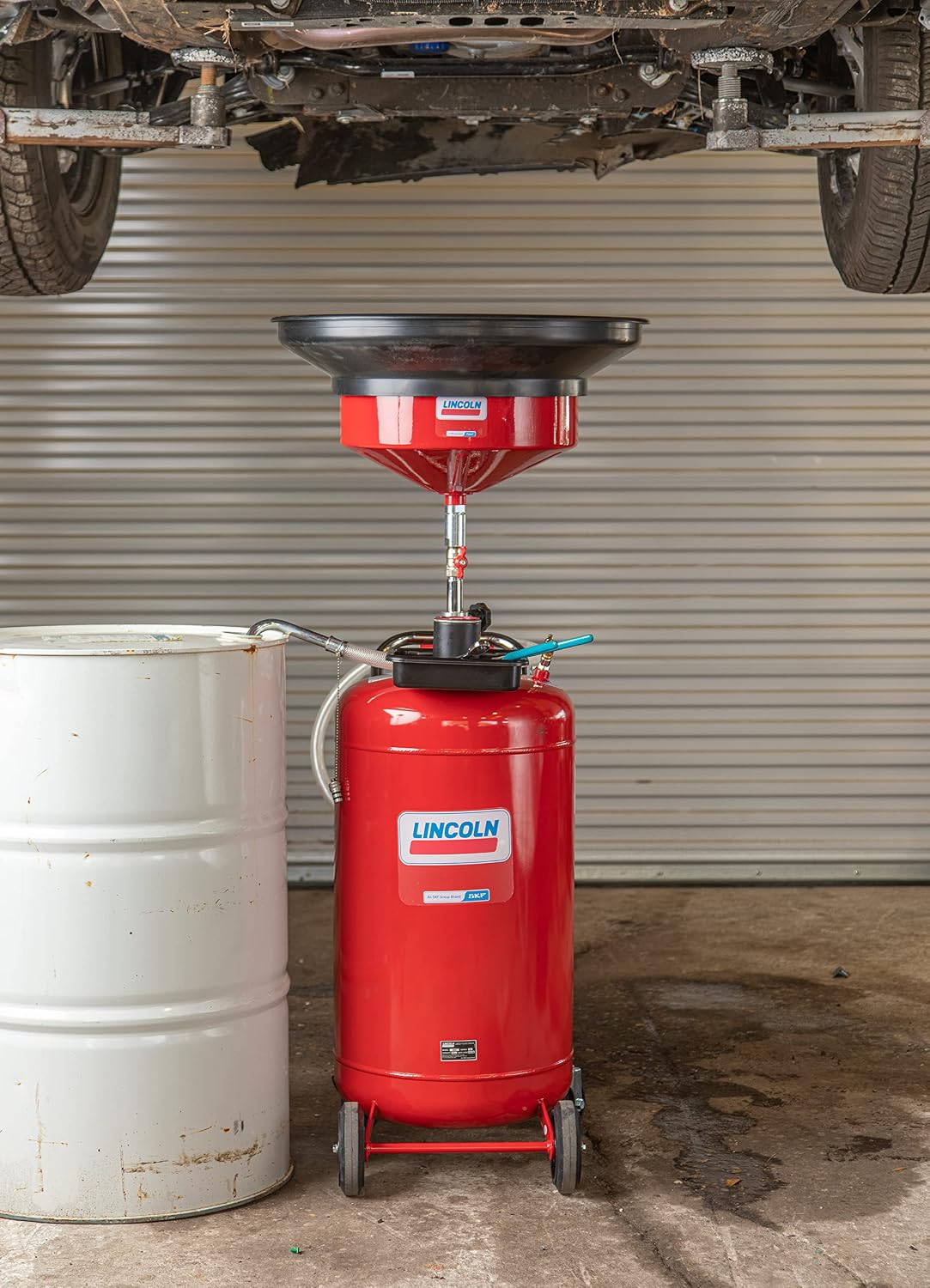 Lincoln 3635 Pneumatic 25 Gallon Pressurized Fluid Drain and Evacuation Tank, 51'-76' Adjustable Funnel Height, Heavy-Gauge Steel, 18' Offset Bowl with Metal Filter Screen, 4' Swivel Casters, Red