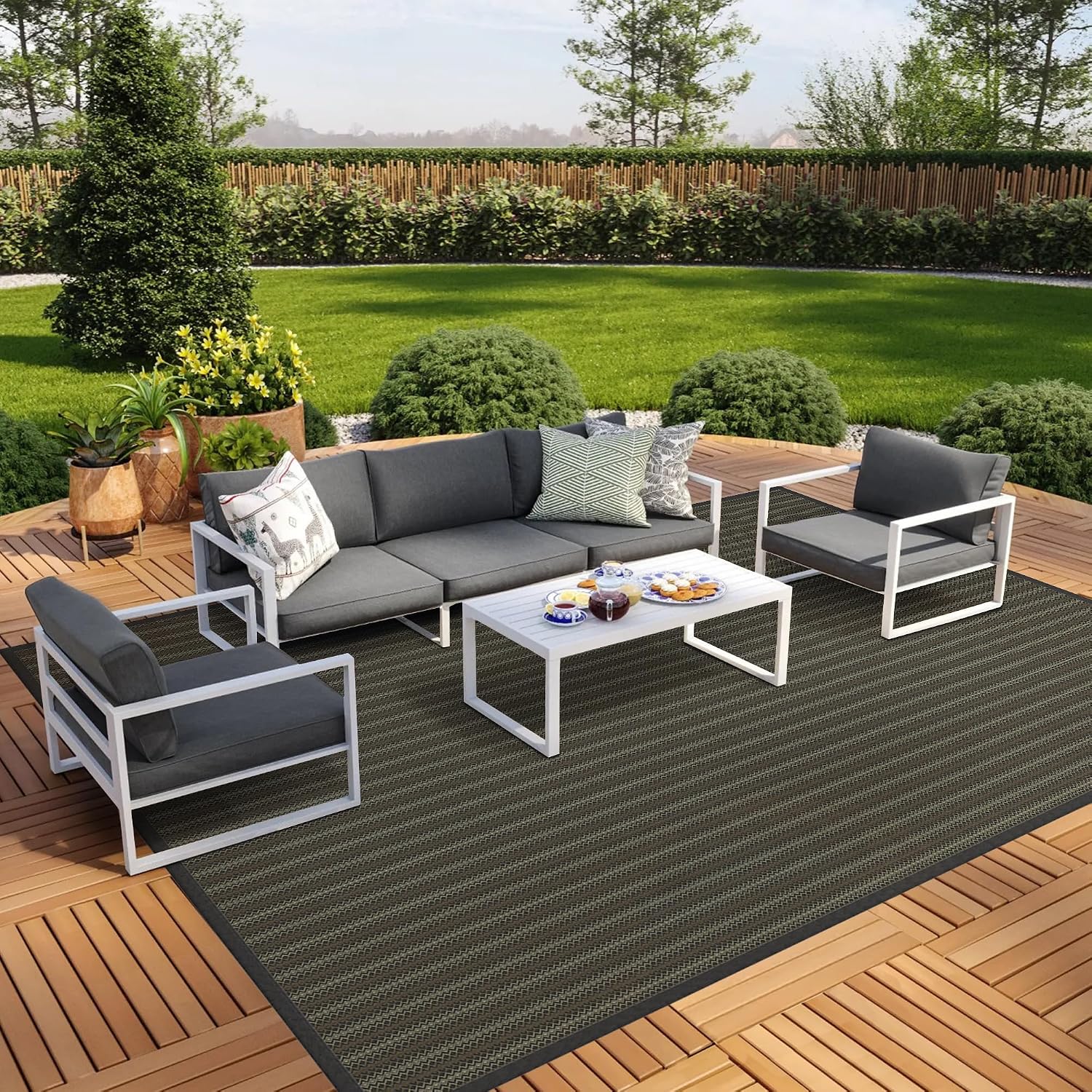 GENIMO Outdoor Rug 10x14 ft Waterproof, Reversible Plastic Straw Patio Rug for RV Camping Mat, Deck, Backyard Balcony Mat - Lightweight & Easy to Clean, Black & Brown
